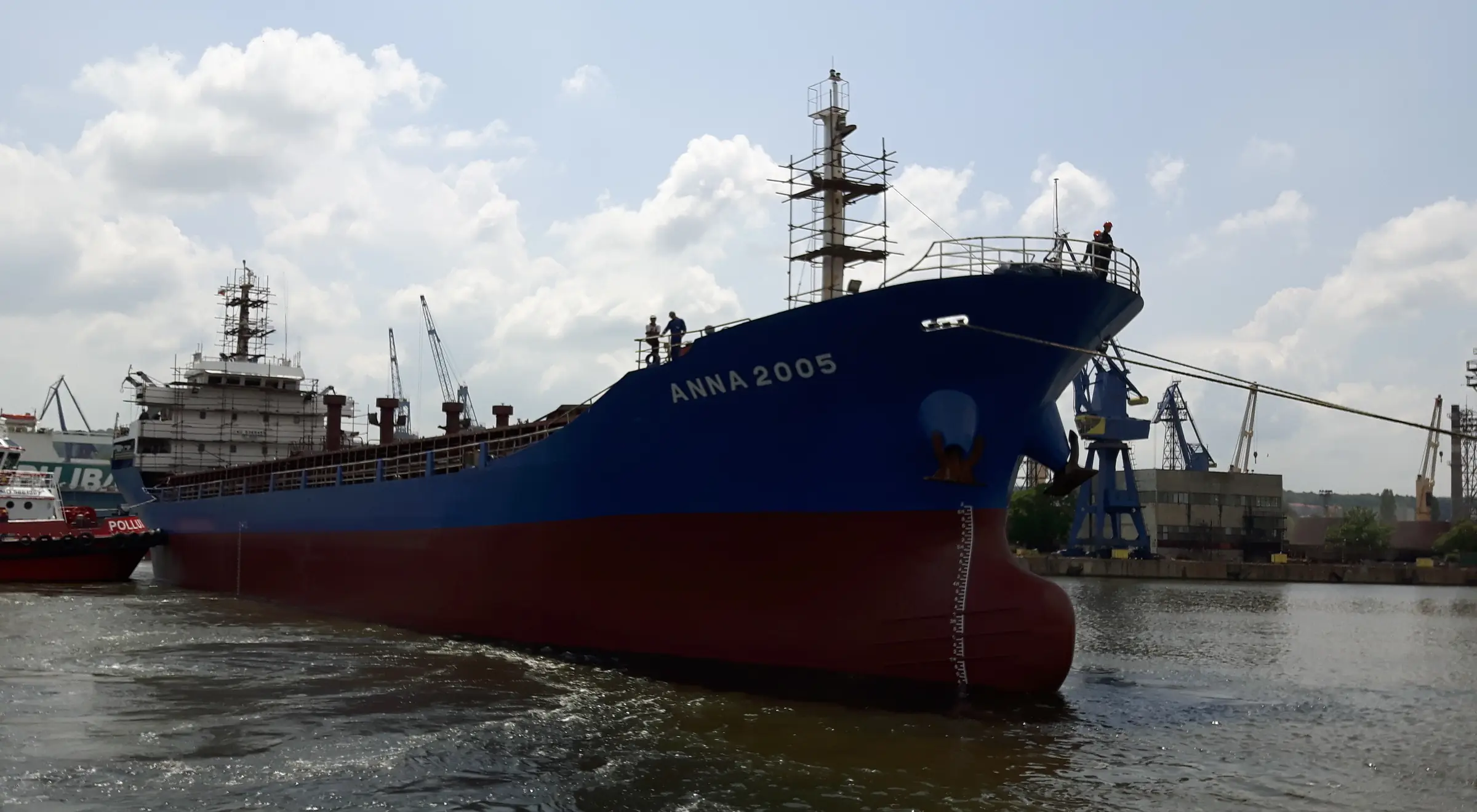 The general cargo vessel Anna 2005 in port, her blue topsides and red bottom paint above the water